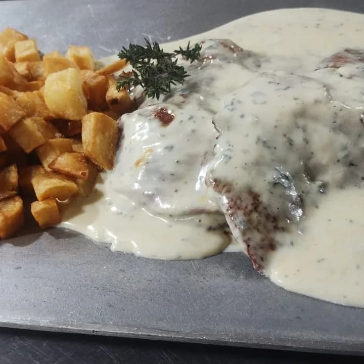 Grilled and sauced pork steak