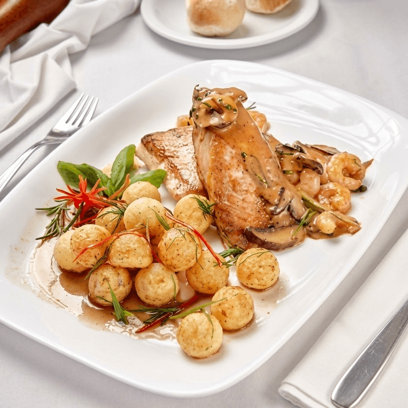 salmon with sauce of shrimps and portobellos